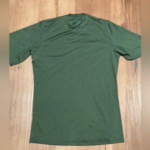 Green base layer T-shirt.